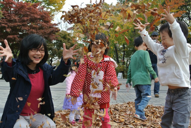 Playing with autumn leave